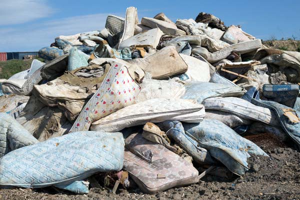 Photo of mattresses in landfill